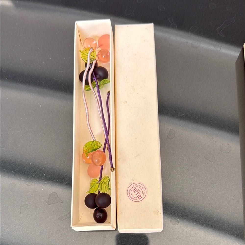 Vietri grape cluster napkin rings in Purple and Peach